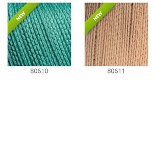 May include: Five spools of embroidery floss in different colors: lime green, teal, beige, black, and dark blue. Each spool has a "NEW" label.