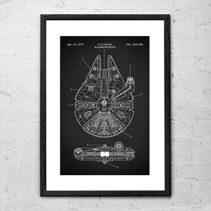 May include: Framed print with a black background, displaying a white blueprint of the Millennium Falcon. The print includes the text "Apr. 19, 1979" and "U.S. Patent MILLENNIUM FALCON". A detailed technical illustration.
