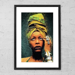 May include: A woman with dark skin and brown eyes is wearing a yellow and green head wrap. She is looking upwards and has a serious expression on her face. She is wearing a silver ankh pendant necklace and a silver ring on her finger.