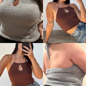 May include: A knitted halter top in gray and brown. The tops feature a keyhole detail at the bust and tie at the neck. The tops are made of a soft, textured knit fabric. The halter tops are a stylish and comfortable choice for warm weather.