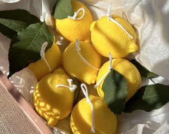 Bougie parfumée en forme de citron, agrumes, bougie fruit, fête du citron, évènementiel, idée déco, aesthetic candle, fête des mères, lemon