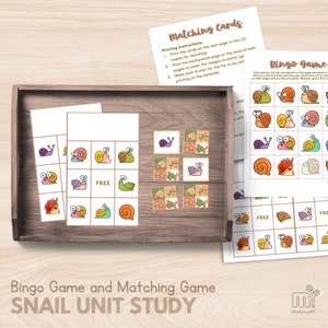 May include: A printable snail-themed bingo game and matching cards set. The set includes two bingo cards, a matching card sheet, and a background page. The cards feature colorful cartoon snails with different shell patterns and colors. The text on the page reads "Bingo Game and Matching Game Snail Unit Study".
