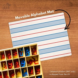 May include: A white alphabet mat with blue and red lines. The mat is designed for use with letter tiles. The mat is shown with a wooden box of letter tiles.