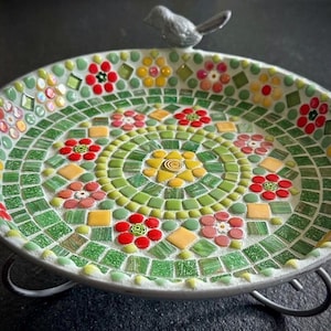 May include: A set of three ceramic mugs with a speckled, matte finish in cream, light brown, and dark brown. Each mug has a simple, minimalist design, ideal for tea or coffee.