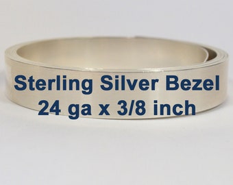 May include: A close-up of a silver bezel strip for jewelry making. The strip is 24 gauge and 3/8 inch wide. Sterling Silver Bezel.