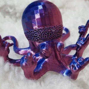 May include: A 3D printed octopus figurine with a blue and purple iridescent finish. The octopus has eight tentacles, each with a hand at the end, making a rock and roll hand gesture.