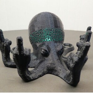 This is the Fucktopus in black colour with a green Led light inside