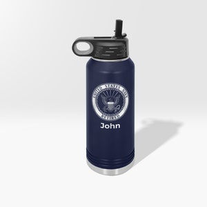 May include: A navy blue stainless steel water bottle with a black lid and a straw. The bottle has a white United States Navy seal with the words "Retired" and "John" printed below it.