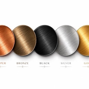 May include: Five circular metal discs arranged in a horizontal row, each featuring a distinct brushed finish. The colors from left to right are copper, bronze, black, silver, and gold. Each disc is labeled below with its corresponding color name.