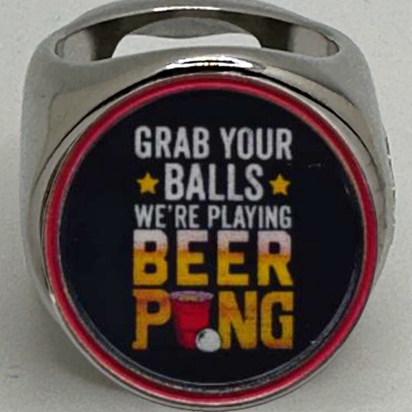 The deCAPitator grab your balls i'm playing beer pong ring bottle cap & can tab opener! Bottle opener Party games Frat Party merchandise