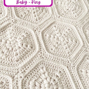 May include: A close-up of a crocheted blanket with a textured, floral pattern in a cream color. The text "6 Blanket Sizes: Baby - King" is visible in the top left corner of the image.