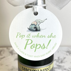 May include: A white round tag with a green elephant illustration and the text 'Pop it when she Pops! Raise a glass & toast when baby Burke arrives'.
Pop It When She Pops Personalized Baby Shower Mini Champagne Bottle Favor Tag Prosecco Elephant Gift Tag Custom Baby Shower Gift Tag