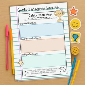May include: A white and teal lined paper with the text "Goals & progress trackers" and "Celebration Page". The page has sections for "This Month's Wins", "Proud Moments at Home", and "Next Goals/Hopes". Includes stickers and pens.