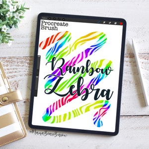 May include: A digital illustration of a rainbow zebra pattern on a tablet screen. The text "Procreate Brush" and "Rainbow Zebra" are visible on the screen. The image is a digital art tutorial.