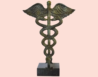 Caduceus - Ancient Greek or Roman herald&#39;s wand, with two serpents twined round it, carried by the messenger god Hermes or Mercury. - Bronze