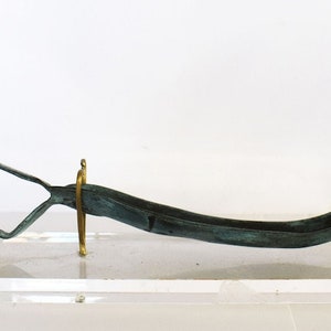 Strigil - Tool for the cleansing of the body by scraping off dirt, perspiration, and oil that was applied in Ancient Greece - Bronze
