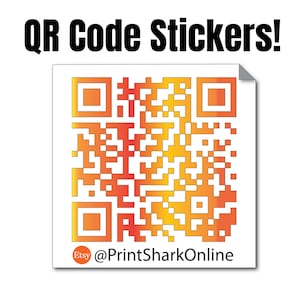 May include: A square sticker with a QR code printed in orange and yellow. The QR code is surrounded by a white border. The text "@PrintSharkOnline" is printed below the QR code.