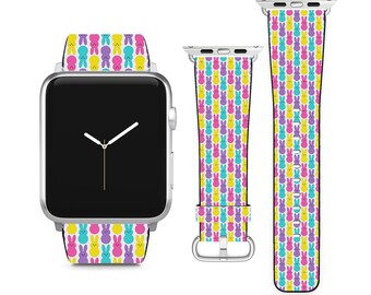 May include: A colorful watch band with a pattern of yellow, pink, and purple bunnies. The band is compatible with Apple Watch.