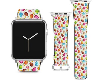 May include: A silver smartwatch with a white band featuring a colorful Easter egg pattern. The band is shown in three pieces: attached to the watch, a short band, and a long band. The eggs are in various colors, including blue, yellow, and pink.