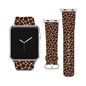 May include: A brown and white giraffe print Apple Watch band with a silver watch face.