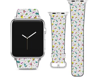 May include: A white Apple Watch band with a colorful geometric pattern. The band is made of silicone and has a silver buckle.