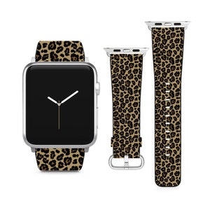 May include: A silver Apple Watch with a brown and black leopard print band. The watch face is black with white hands.