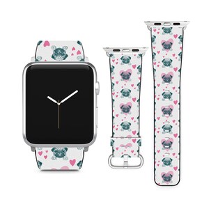 May include: A white Apple Watch band with a pattern of pugs and pink hearts. The band is shown on a silver Apple Watch.