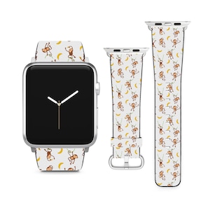 May include: A white Apple Watch band featuring a pattern of monkeys swinging from vines and holding bananas. The band is compatible with Apple Watch Series 4 and later.