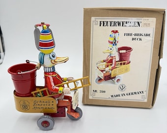Juguete de hojalata de pato de bomberos de Alemania Wilesco 280 Blechspielzeug Windup Works en caja