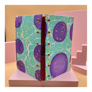 Burning Man Marbled Notebook. 104 White and Red Pages.