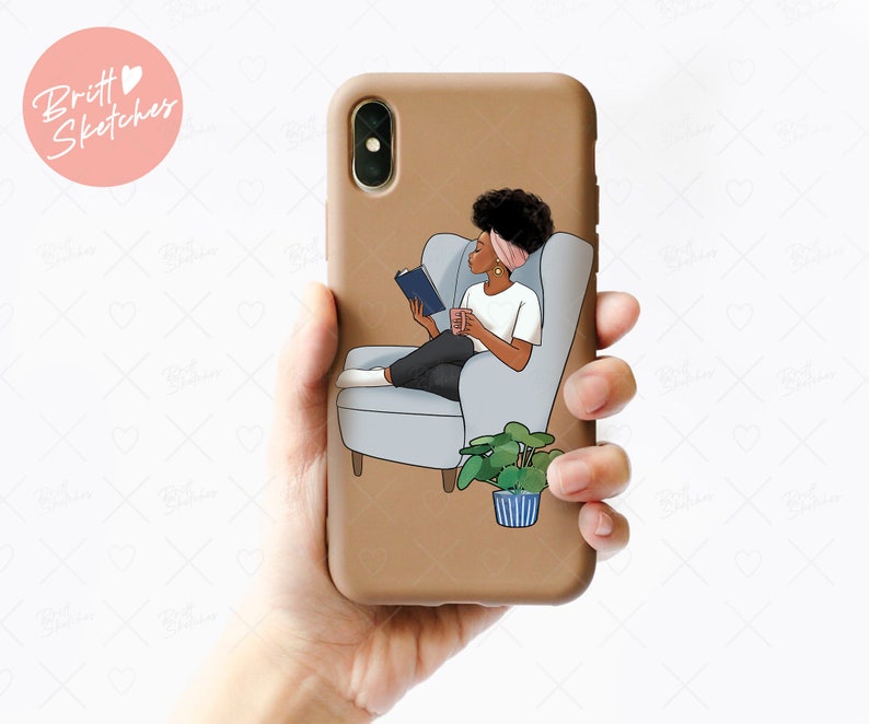 May include: A brown phone case featuring an illustration of a person reading a book while seated in a gray armchair. The illustration includes a plant in a blue and white striped pot. The phone case has the text "Britt Sketches" in a pink circle.