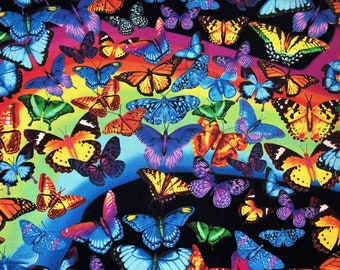 May include: A vibrant pattern featuring numerous butterflies in various colors, including blue, orange, yellow, and purple. The butterflies are set against a rainbow gradient background, creating a lively and colorful design. The overall theme is nature and whimsy.