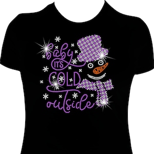 May include: Black t-shirt with a purple and white rhinestone design of a snowman with the text "Baby it's cold outside".