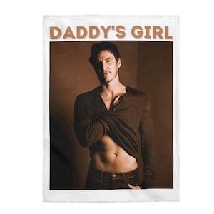 May include: A brown and white photo of a man with a dark brown shirt partially unbuttoned, revealing his torso. The photo is framed with a white border and the text "DADDY'S GIRL" is printed in brown letters at the top.