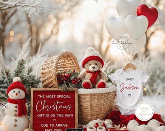 Könnte beinhalten: Eine weihnachtliche Babyankündigung mit Schneemann, Teddybär und Babykleidung. Herzförmige Ballons und ein rotes Schild mit der Aufschrift "Das ganz besondere Weihnachtsgeschenk kommt!" und "Ankunft Mai 2026" sind enthalten.