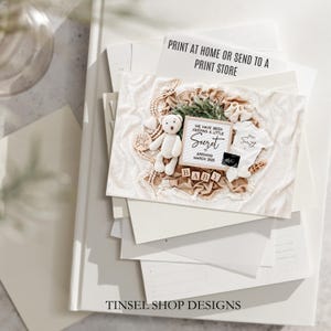 May include: A pregnancy announcement card with a teddy bear, baby clothes, and wooden blocks spelling "BABY." The card includes the text "WE HAVE BEEN KEEPING A LITTLE SECRET ARRIVING MARCH 2025" and "PRINT AT HOME OR SEND TO A PRINT STORE."