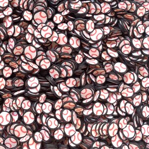 May include: A large pile of white and red baseball-themed embellishments. The embellishments are round and have a black outline. They are perfect for adding a sporty touch to crafts.