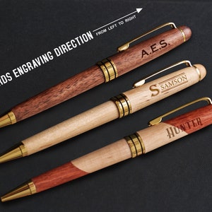 three different types of wooden pens on a table