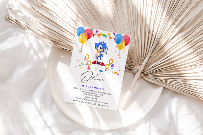 May include: A blue and white birthday invitation with a cartoon character, Sonic the Hedgehog, holding a golden ring. The invitation is decorated with colorful balloons, confetti, and the text "Oliver is turning six".