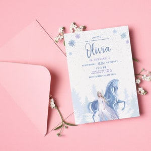 May include: A blue and white invitation card with a snowflake design. The text on the card reads "Olivia is turning 4 September 23, 2023 Saturday 12-6 PM 1234 Disney Way Orlando, FL 12345 RSVP to Mom 123-456-7890".