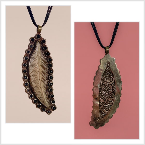 Large Tibetan Antiqued Buffalo Bone Carved Feather Pendant with Black Onyx. Beautiful floral design on the back, large bail at the top.