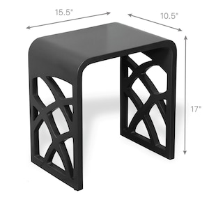 May include: Black side table with a geometric design on the sides. The table is 15.5 inches wide, 10.5 inches deep, and 17 inches tall. The top has rounded corners.