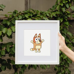 May include: A white picture frame with a white mat and a cartoon image of a brown and orange dog with a white belly and a white muzzle. The dog is standing on its hind legs with its front paws raised in the air. The dog has a big smile and big eyes.