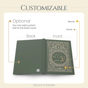 May include: Open journal with a green cover and decorative gold-colored text. The front cover reads "KEEPING SCORE game night." The back cover is blank, with the option to add custom text. The word "CUSTOMIZABLE" is at the top.