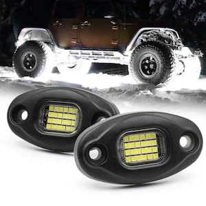 May include: Two black oval-shaped LED lights with a white LED grid inside. The lights are designed for off-road vehicles and have a waterproof design.