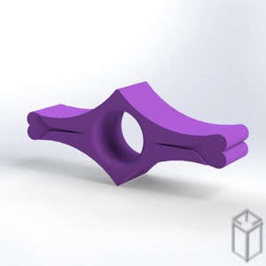 May include: Purple plastic book page holder with a heart-shaped design on the ends. The holder is designed to fit over a page and keep it open.