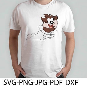 May include: White t-shirt with a cartoon image of Taz the Tasmanian Devil in a whirlwind.