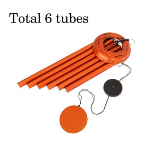 May include: Orange wind chime with six tubes, a circular top, and a black disc-shaped clapper. The text "Total 6 tubes" is at the top. The wind chime is designed to hang and produce sound.