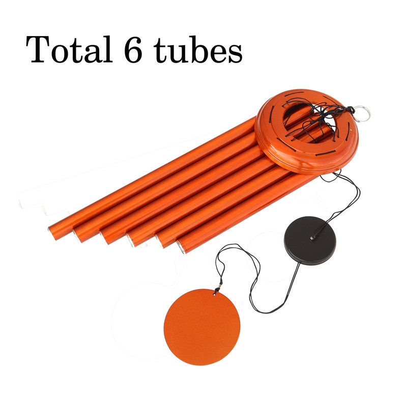 May include: Orange wind chime with six tubes, a circular top, and a black disc-shaped clapper. The text "Total 6 tubes" is at the top. The wind chime is designed to hang and produce sound.