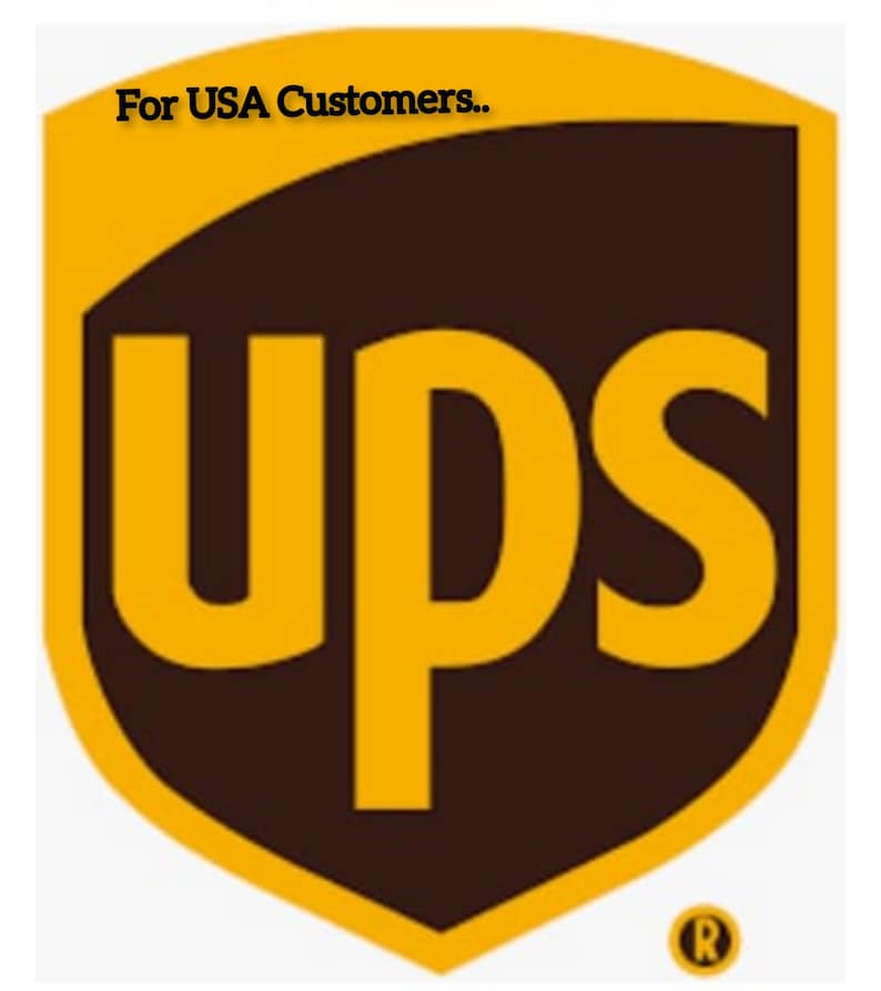 May include: The UPS logo is a brown shield with a gold outline. The letters UPS are in gold and are centered on the shield. The logo has a registered trademark symbol in the lower right corner. The text "For USA Customers." is above the logo.